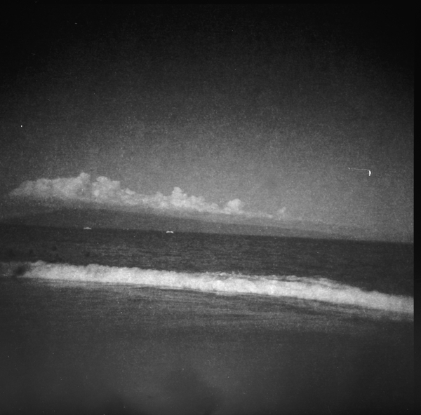 Small photo of Waves crashing, with Lānaʻi from Kahekili