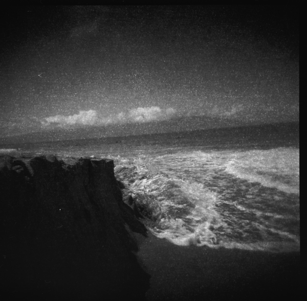 Small photo of Waves Crashing on Sand 'Cliffs'